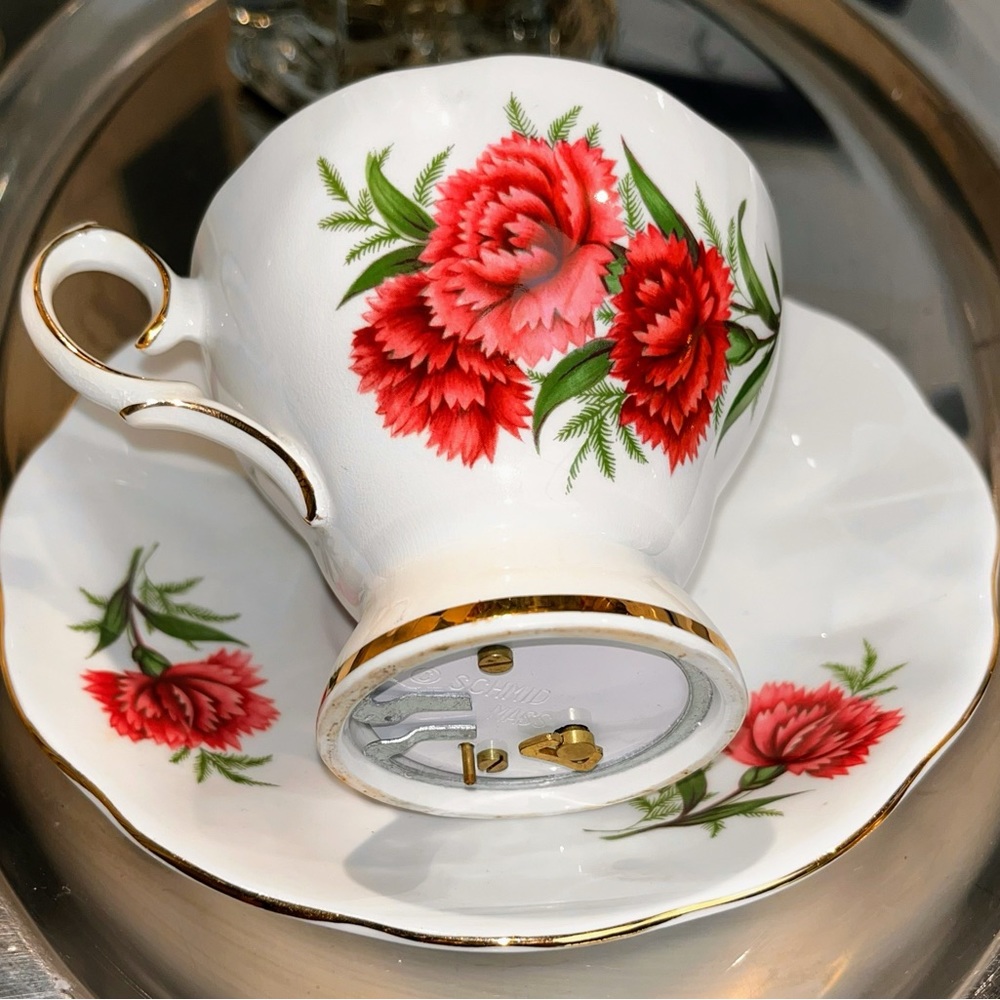 Candle in fine bone china tea cup and matching saucer